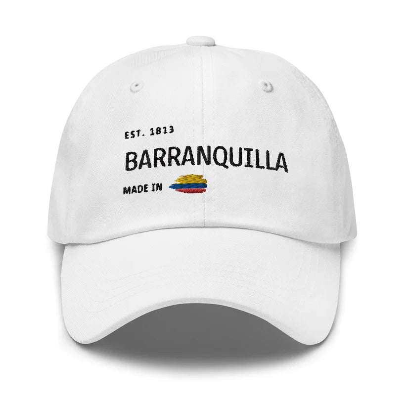 White dad hat featuring 'Barranquilla - Made in Colombia' embroidered design with a small Colombian flag. A stylish and minimal cap celebrating Barranquilla rich heritage and culture.