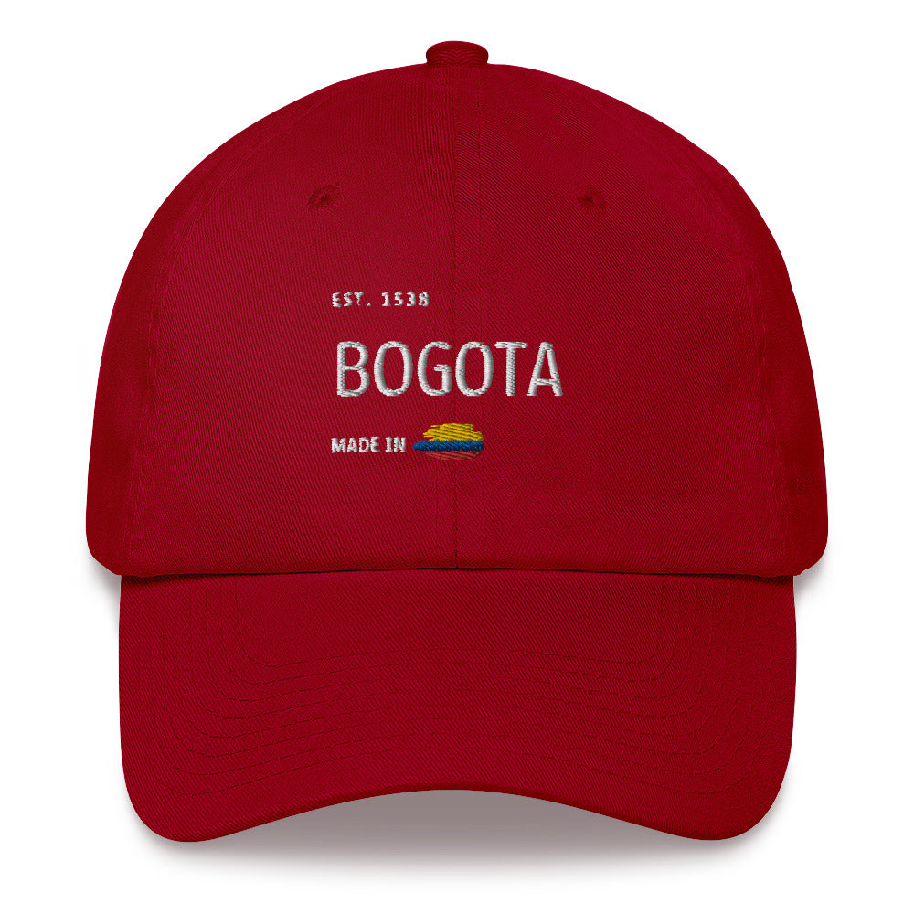 Classic Red Cranberry-colored dad hat with 'Bogotá' embroidery, featuring 'Made in Colombia' and the Colombian flag detail. A stylish tribute to Colombia’s capital.