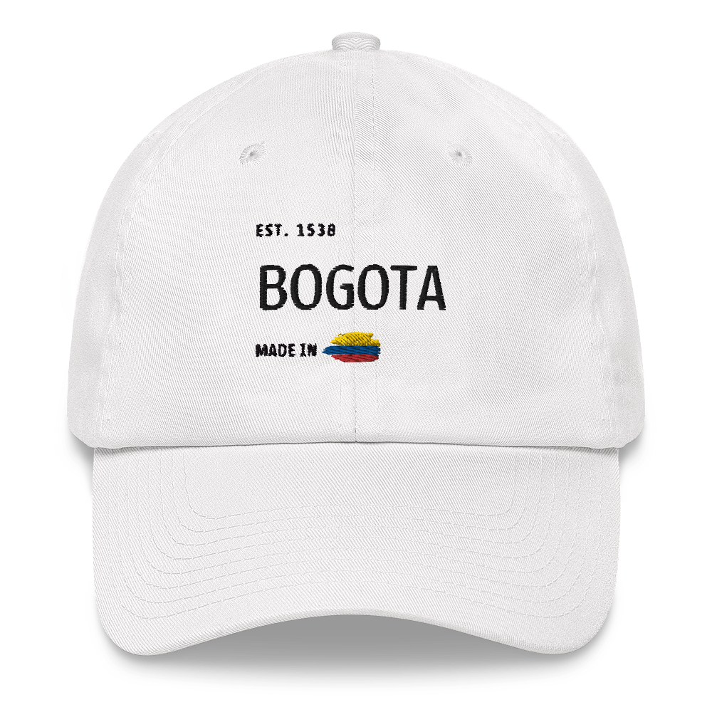 White dad hat featuring 'Bogota- Made in Colombia' embroidered design with a small Colombian flag. A stylish and minimal cap celebrating Bogota rich heritage and culture.