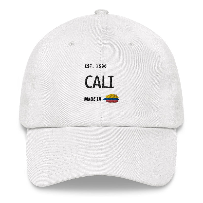 White dad hat featuring 'Cali - Made in Colombia' embroidered design with a small Colombian flag. A stylish and minimal cap celebrating Cali’s rich heritage and culture.