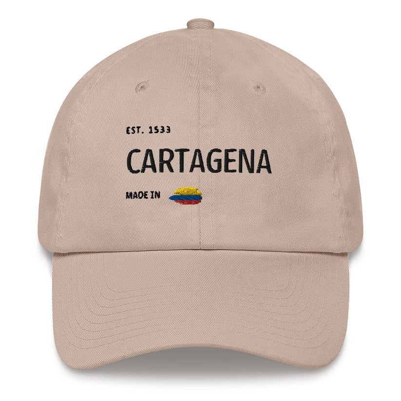 Stone dad hat featuring 'Cartagena - Made in Colombia' embroidered design with a small Colombian flag. A stylish tribute to Cartagena's rich history and culture."