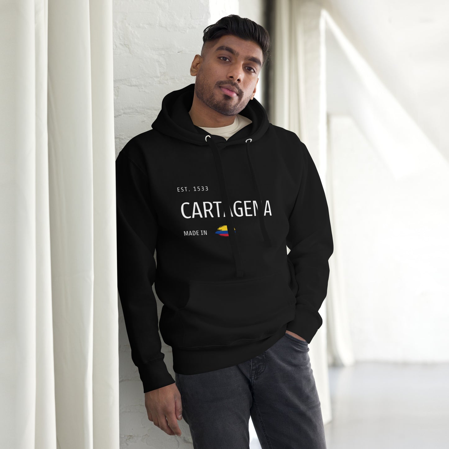 Black premium hoodie featuring 'CARTAGENA' text with an embroidered Colombian flag accent, symbolizing the rich culture and history of Cartagena, Colombia.