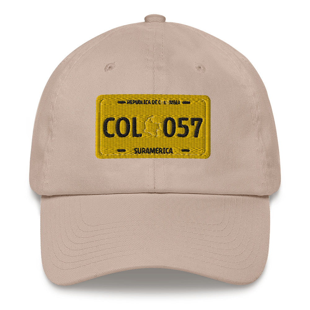 Classic Stone dad hat featuring a vintage yellow Colombian license plate design with 'COL 057 Suramérica' text. A stylish way to represent Colombian culture with a retro touch