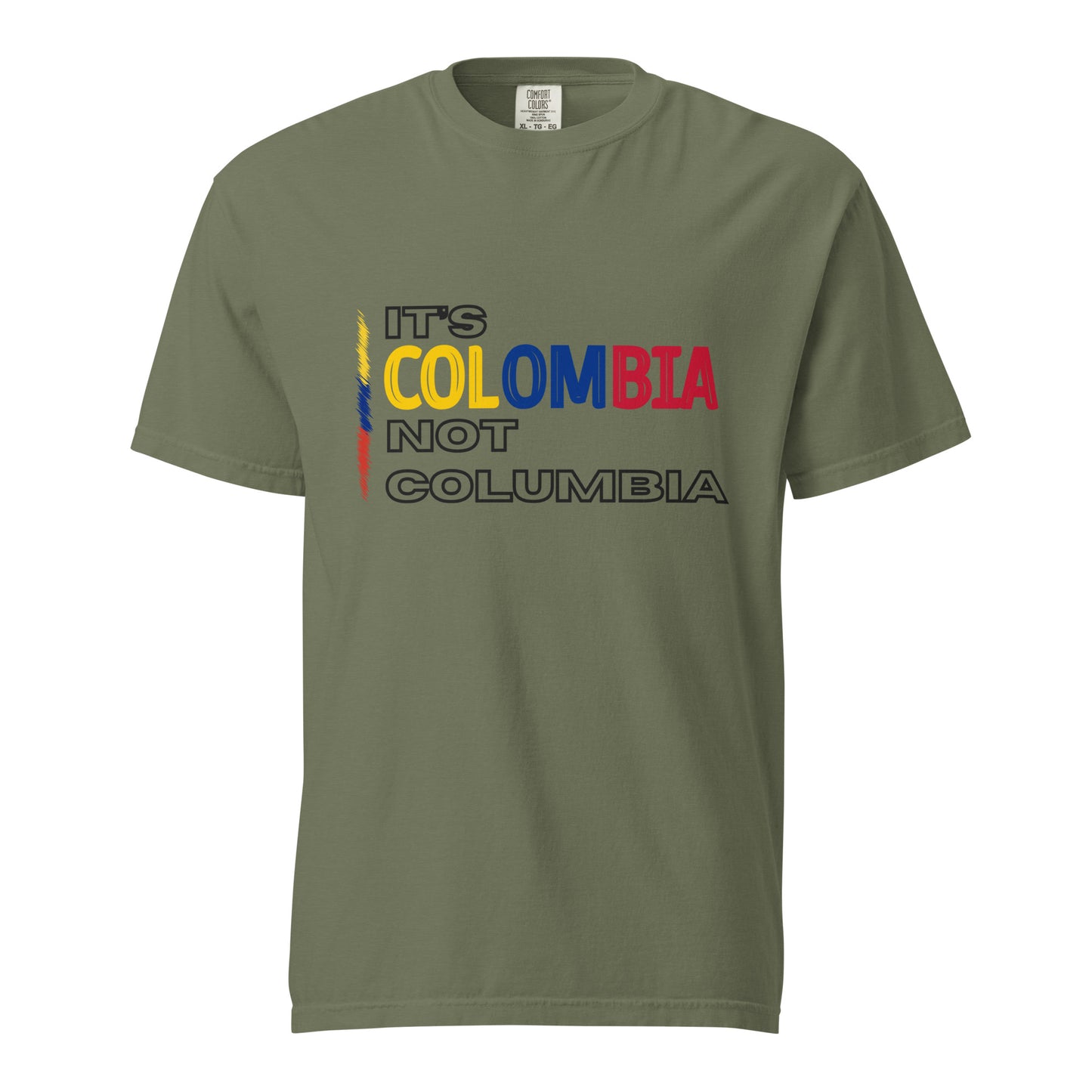 Moss Greenheavyweight t-shirt with bold text saying 'It's Colombia Not Columbia' in blue, yellow, and red. A statement piece for Colombian pride.