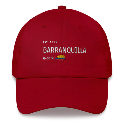 Classic Red Cranberry dad hat featuring 'Barranquilla' embroidery, with 'Made in Colombia' and a Colombian flag detail. A stylish tribute to Colombia’s vibrant coastal city.