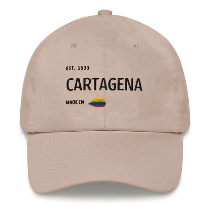 Stone dad hat featuring 'Cartagena - Made in Colombia' embroidered design with a small Colombian flag. A stylish tribute to Cartagena's rich history and culture."