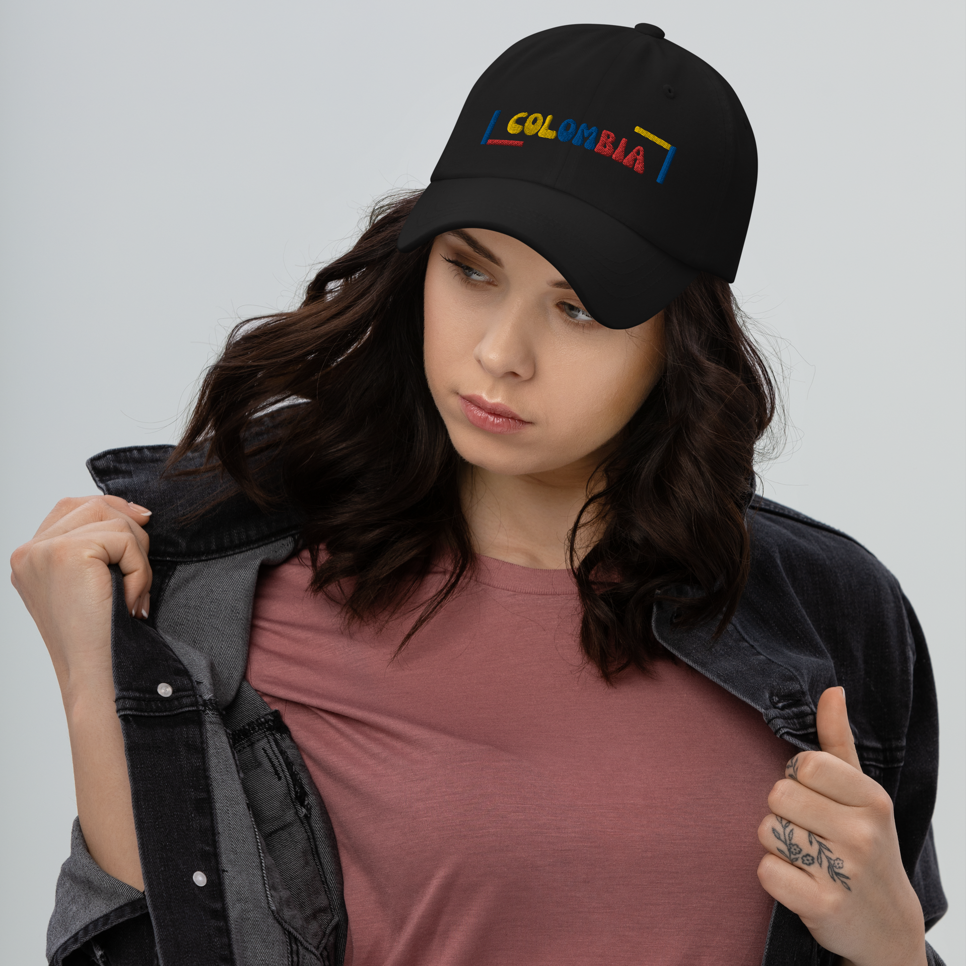 Classic Black dad hat featuring a colorful 'COLOMBIA' text design in yellow, blue, and red, inspired by the Colombian flag.