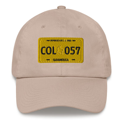 Classic Stone dad hat featuring a vintage yellow Colombian license plate design with 'COL 057 Suramérica' text. A stylish way to represent Colombian culture with a retro touch