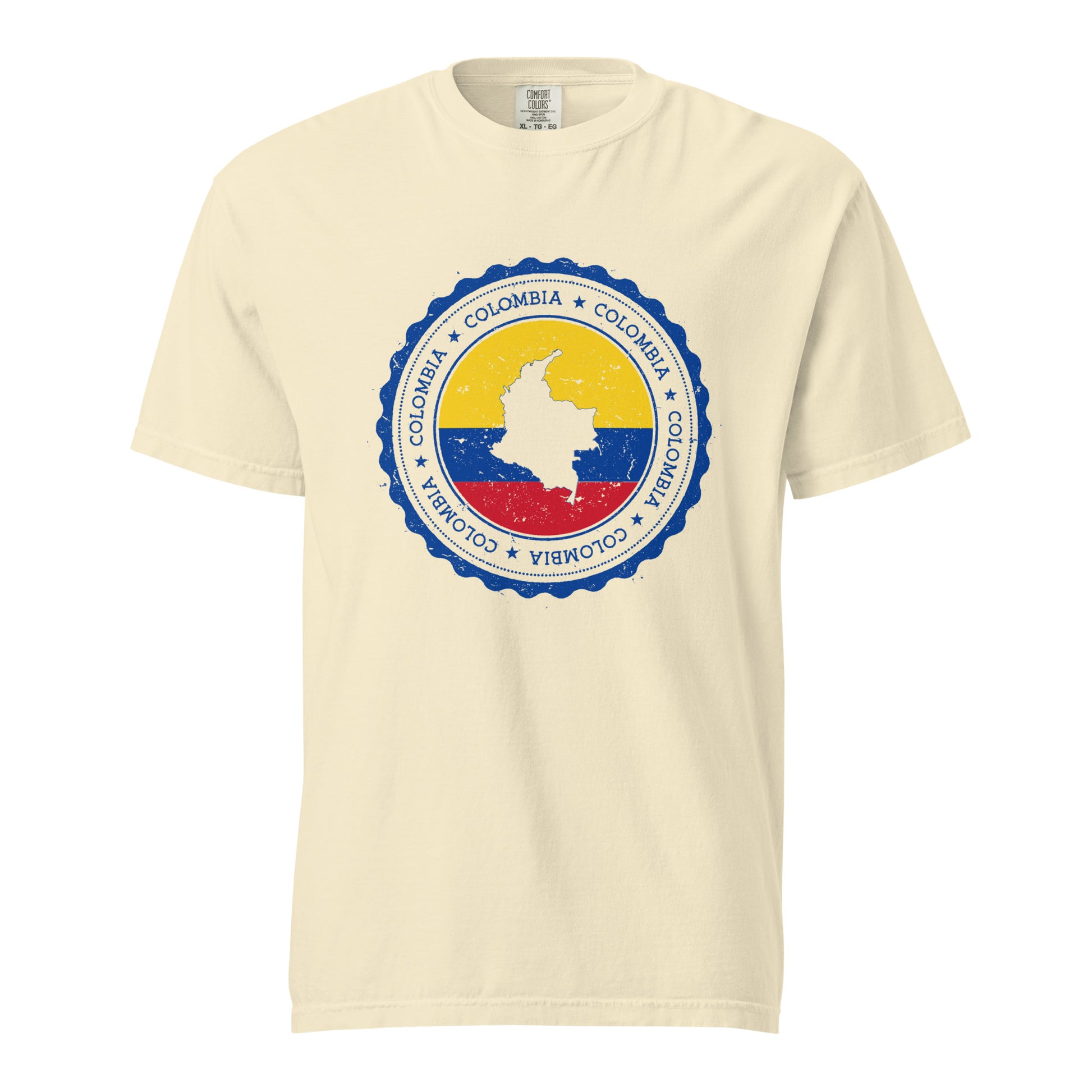 Ivory unisex heavyweight T-shirt featuring a circular Colombian heritage design with vibrant yellow, blue, and red accents, highlighting cultural pride and style.