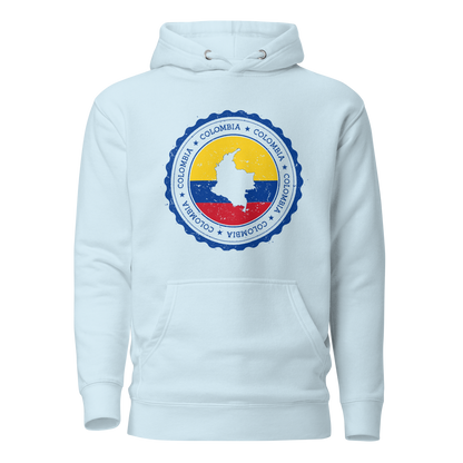 Unisex Sky Blue hoodie featuring a circular Colombian heritage design with vibrant yellow, blue, and red accents, perfect for showcasing cultural pride and style