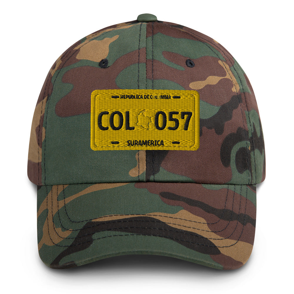 Classic green camo dad hat featuring a vintage yellow Colombian license plate design with 'COL 057' Military-Style. A rugged and stylish way to represent Colombian culture.