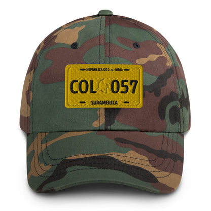 Classic green camo dad hat featuring a vintage yellow Colombian license plate design with 'COL 057' Military-Style. A rugged and stylish way to represent Colombian culture.