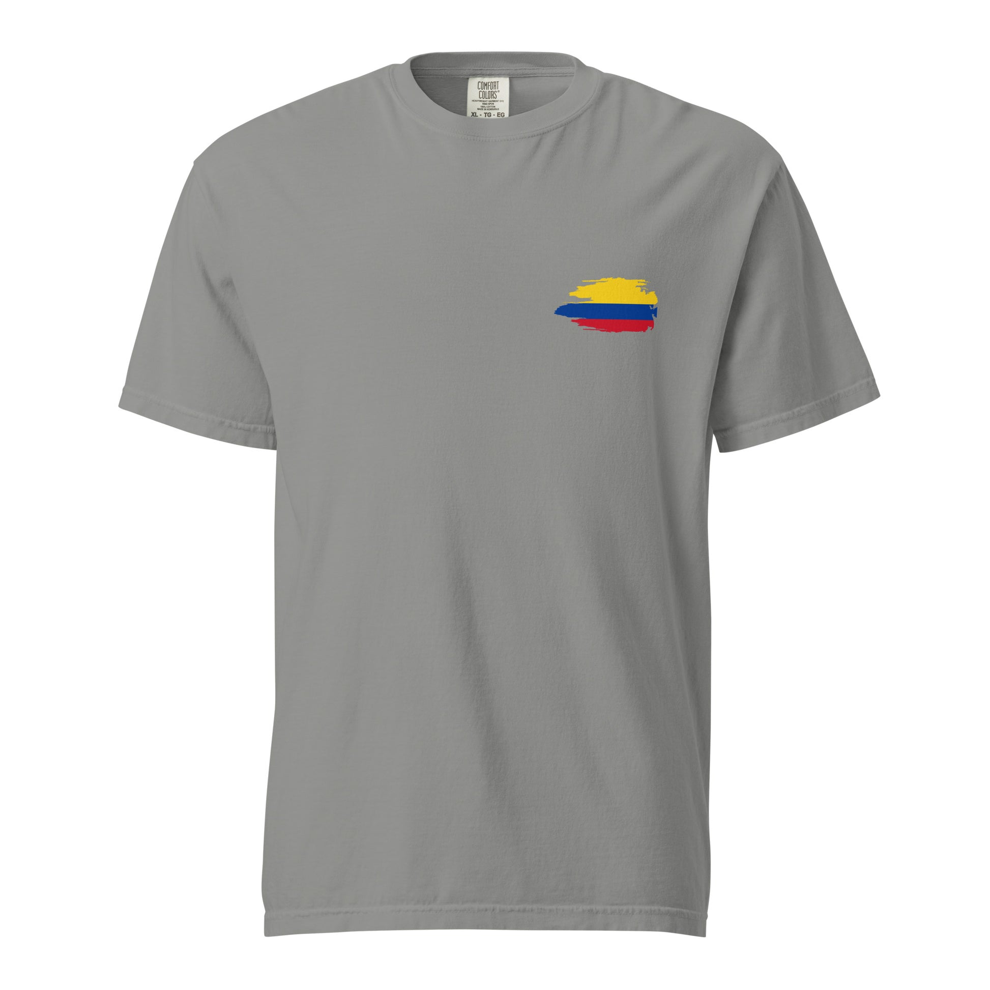 Grey heavyweight t-shirt featuring a fun 'Colombian Nutrition Facts' design on the back. Lists attributes like creativity, passion, and pride with humorous daily values. Perfect for proud Colombians and culture lovers.