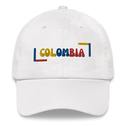 Classic white dad hat featuring a colorful 'COLOMBIA' text design in yellow, blue, and red, inspired by the Colombian flag.