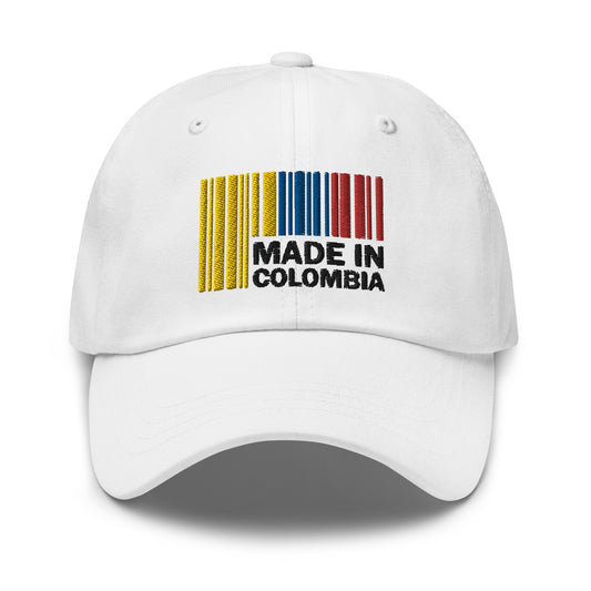 Unisex white dad hat featuring a vibrant Colombian-themed design on the side, worn by a model with hands resting on their head, showcasing the hat's stylish look.