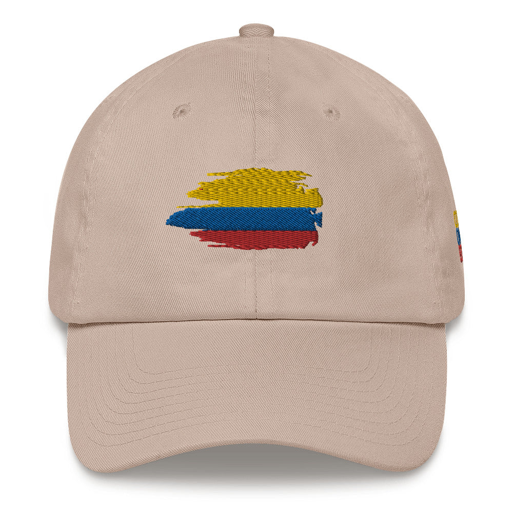 Classic Stone dad hat featuring an embroidered Colombian flag brushstroke design. A stylish and subtle way to represent Colombian pride with a modern artistic touch.